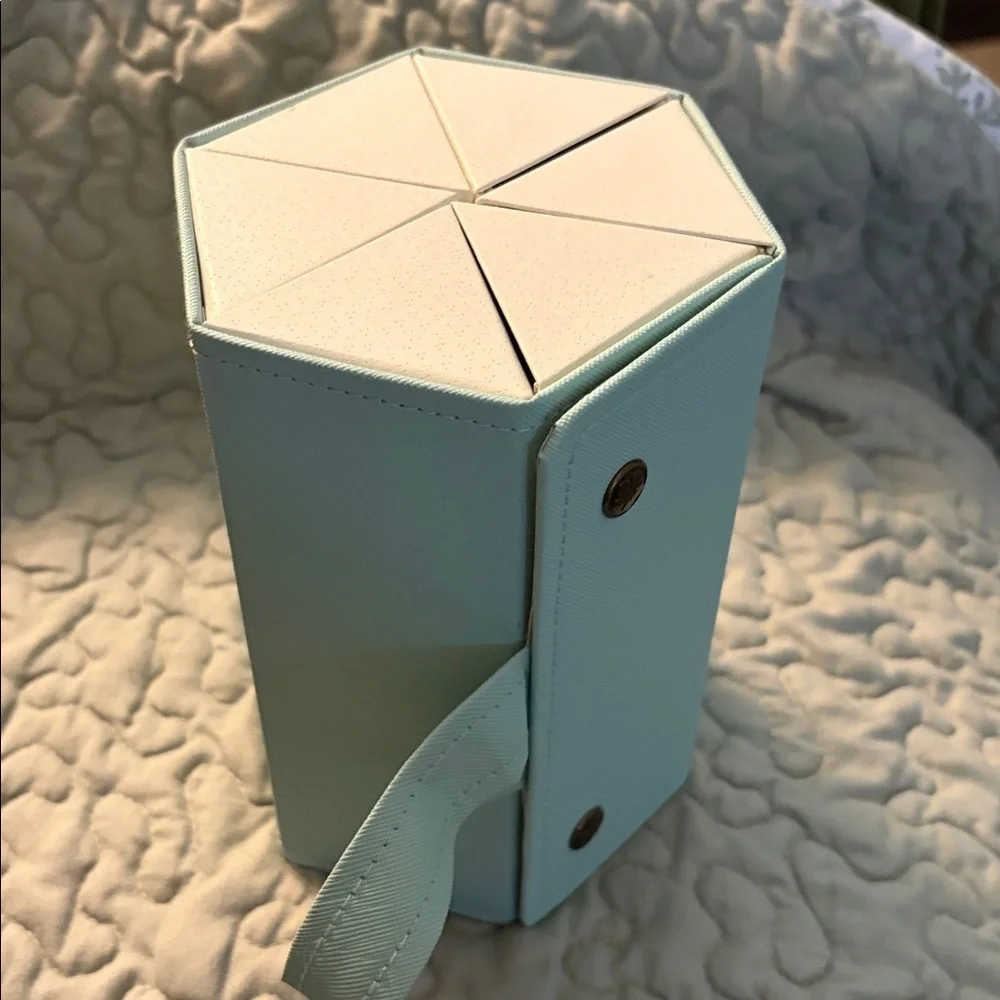 Six compartment roll up glass case.